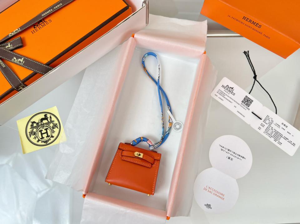 designer,replica,clothing,fake,1:1,lv,luxury,high quality HERMES mini Kelly bag (persimmon orange) kelly twilly charm designer,replica,clothing,fake,1:1,lv,luxury,high quality HERMES mini Kelly bag (persimmon orange) kelly twilly charm