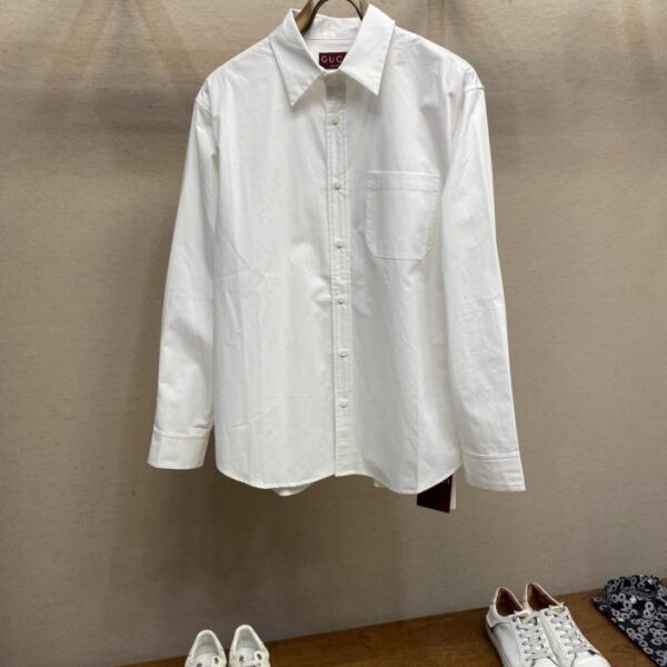 designer,replica,clothing,fake,1:1,lv,luxury,high quality Gucci’s new white shirt features exquisite logo embroidery and custom buttons. This loose-fitting shirt is available for both men and women.
